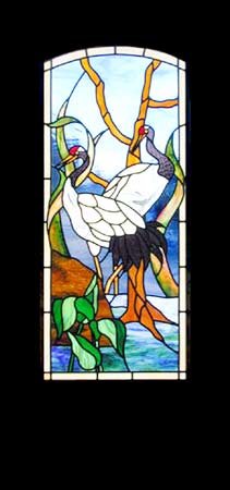 door with oriental cranes stained and leaded glass window