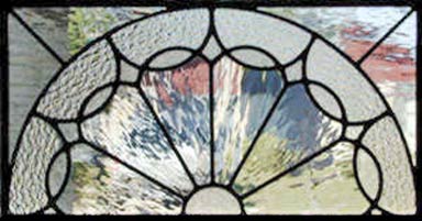 Custom leaded glass phony arch window.