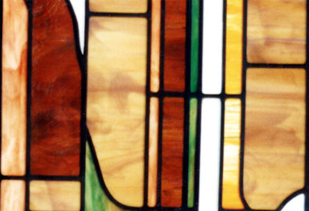 Closeup of custom stained and leaded glass abstract leaded glass window