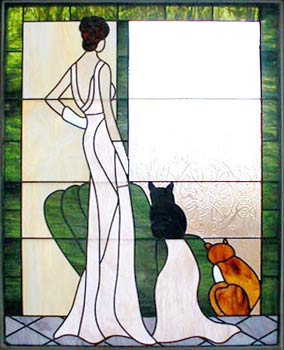 stained and leaded glass lady with 2 cats