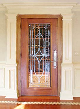 mahogany door with all beveled leaded glass window