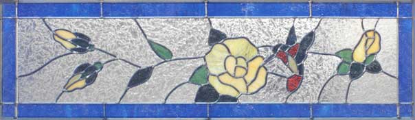 stained glass hummingbird with flowers