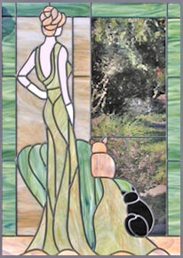 stained and leaded glass lady with 2 cats