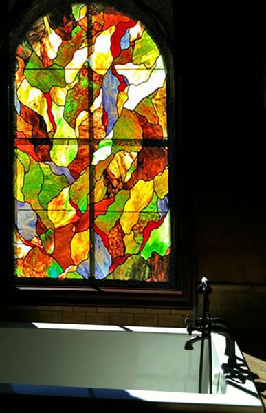 ritchie-leigh-bathtub abstract arch stained and leaded glass window designed and fabricated by Jack McCoy